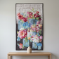 Vase with Flowers floral wall quilt displayed on a light-grey wall above an oak console with a cream ceramic vase.