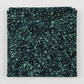 Folded Terrazzo Smoky Teal batik fabric by Riley Blake Designs, showing soft teal terrazzo speckles on a dark navy-teal ground against a light gray background.