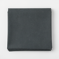 Spotted Charcoal quilting cotton fabric folded to show texture – deep charcoal-grey tonal speckled near-solid blender by Zen Chic for Moda Fabrics, 100% cotton