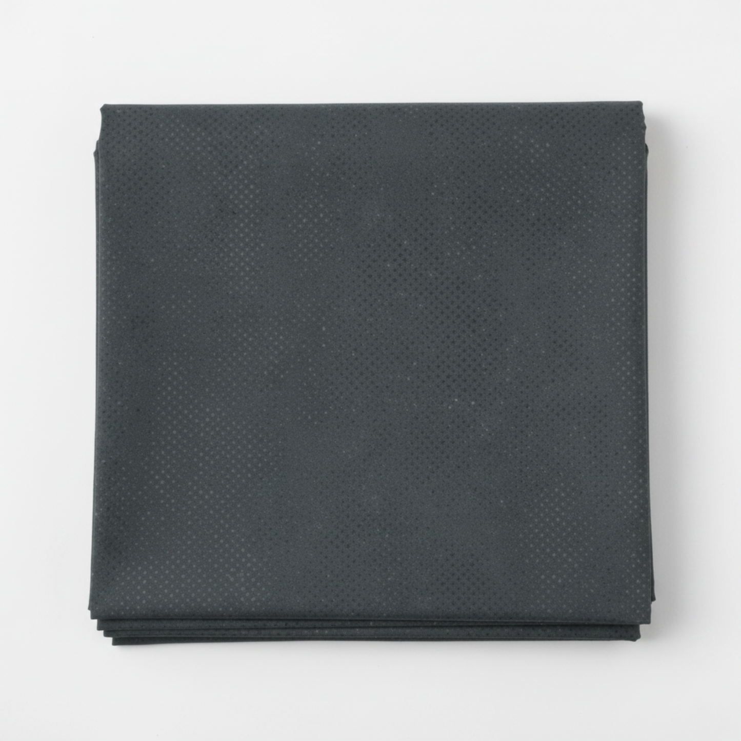 Spotted Charcoal quilting cotton fabric folded to show texture – deep charcoal-grey tonal speckled near-solid blender by Zen Chic for Moda Fabrics, 100% cotton