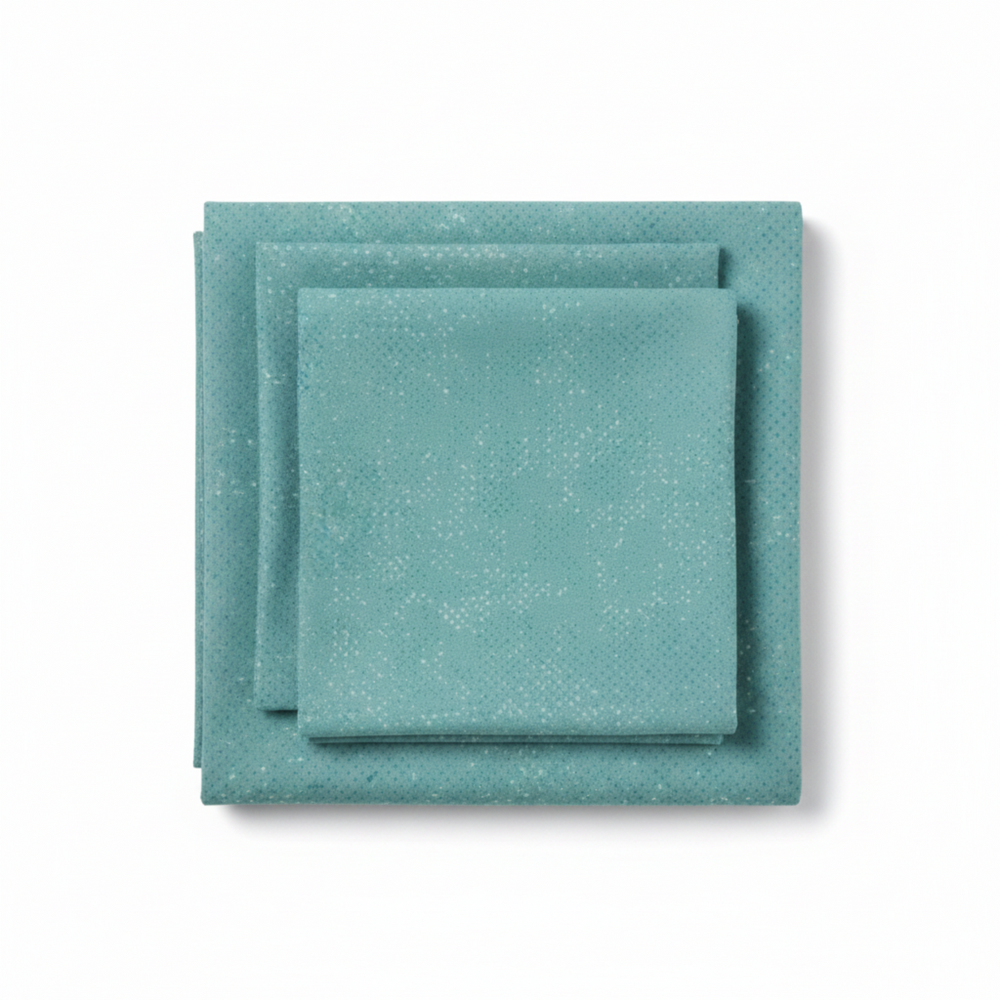 Spotted Dusty Teal quilting cotton fabric by Zen Chic for Moda Fabrics folded into a neat stack showing medium teal-blue with cool aqua undertones and subtle tonal speckled texture – a versatile near-solid blender, 100% cotton, 43–44" wide