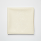 Spotted Ivory quilting cotton fabric folded to show texture – soft warm ivory tonal speckled near-solid by Zen Chic for Moda Fabrics, 100% cotton