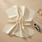 Spotted Ivory quilting cotton fabric by Zen Chic for Moda Fabrics arranged in a studio flat lay with rotary cutter and acrylic ruler – soft warm ivory tonal speckled blender, 100% cotton