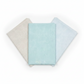 Three coordinating tonal speckled near-solid blender fabrics in a fan arrangement featuring Spotted Mist by Zen Chic for Moda Fabrics in soft pale icy aqua-blue, 100% cotton