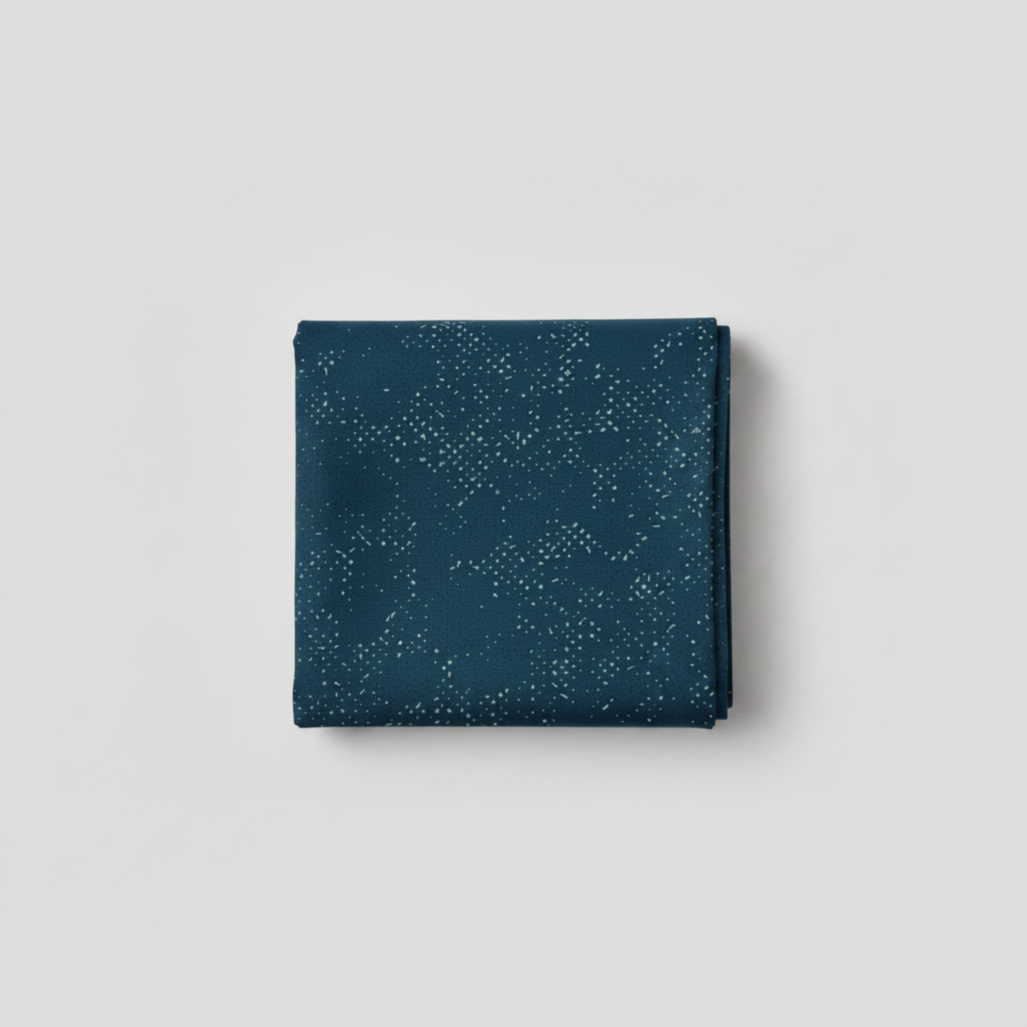 Spotted Mood Dark Blue fabric by Zen Chic for Moda Fabrics — deep teal-navy ground with scattered light dot texture, 100% cotton quilting blender. Available at IraRobi Quilts.