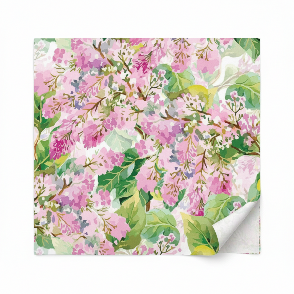 Decoupage Pink Lilac floral quilting fabric shown flat with one corner folded back to reveal the fabric surface.