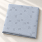 Folded Celestial Nine Triangle Stardust fabric by Zen Chic for Moda Fabrics in soft natural light.