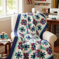 Starlit Pathways quilt pattern by Studio 180 Design — stunning Hunter's Star variation in teal, purple, and red batiks with navy border — available in throw, extra long twin, and king sizes — uses Rapid Fire Hunter's Star Large Star and Tucker Trimmer I tools — pattern DTDD104 by Sarah Furrer