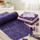 Dark purple hand-dyed batik quilting fabric styled with coordinating purple fabrics and quilting tools – Expressions Batiks by Riley Blake Designs at IraRobi Quilts