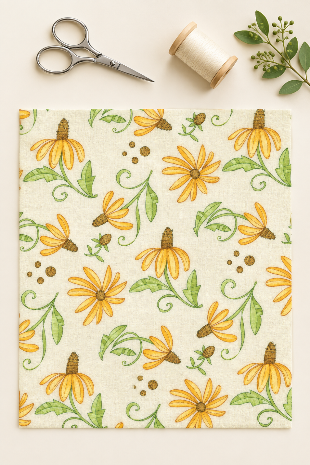 Superbloom Daisyish Cream Fabric by Robin Pickens for Moda Fabrics, laid flat on a cream background beside silver scissors, cream thread, and greenery.