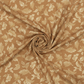 Front Porch Swing Rust quilting cotton by Dolores Smith for Marcus Fabrics — fabric swirled into a spiral pinwheel showing softness and drape, warm rust-amber ground with cream scrolling acanthus leaf motif