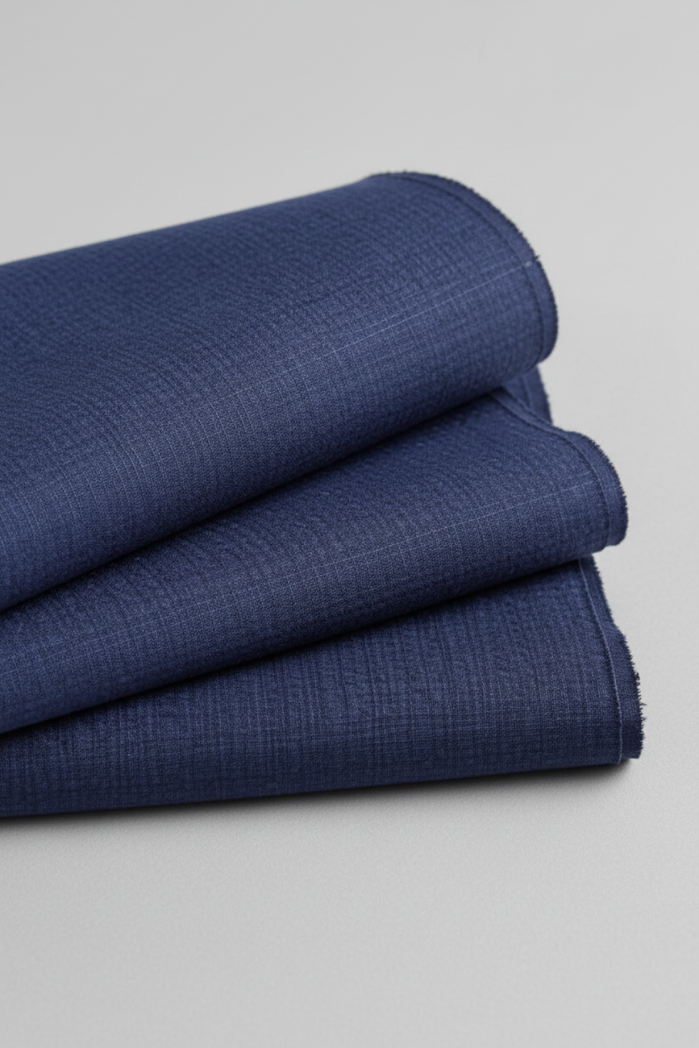 olded Thatched Navy quilting cotton by Robin Pickens for Moda Fabrics on a light grey background.