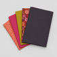 Thatched Shadow deep purple fabric by Robin Pickens for Moda Fabrics shown in a coordinating fabric fan with Thatched Fuchsia and Thatched Green Curry — all available at IraRobi Quilts.