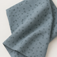 Folded Modern Background Even More Paper Steel Crosshatch fabric by Zen Chic for Moda Fabrics, showing small dark crosshatch marks on steel blue-gray fabric against a light background.