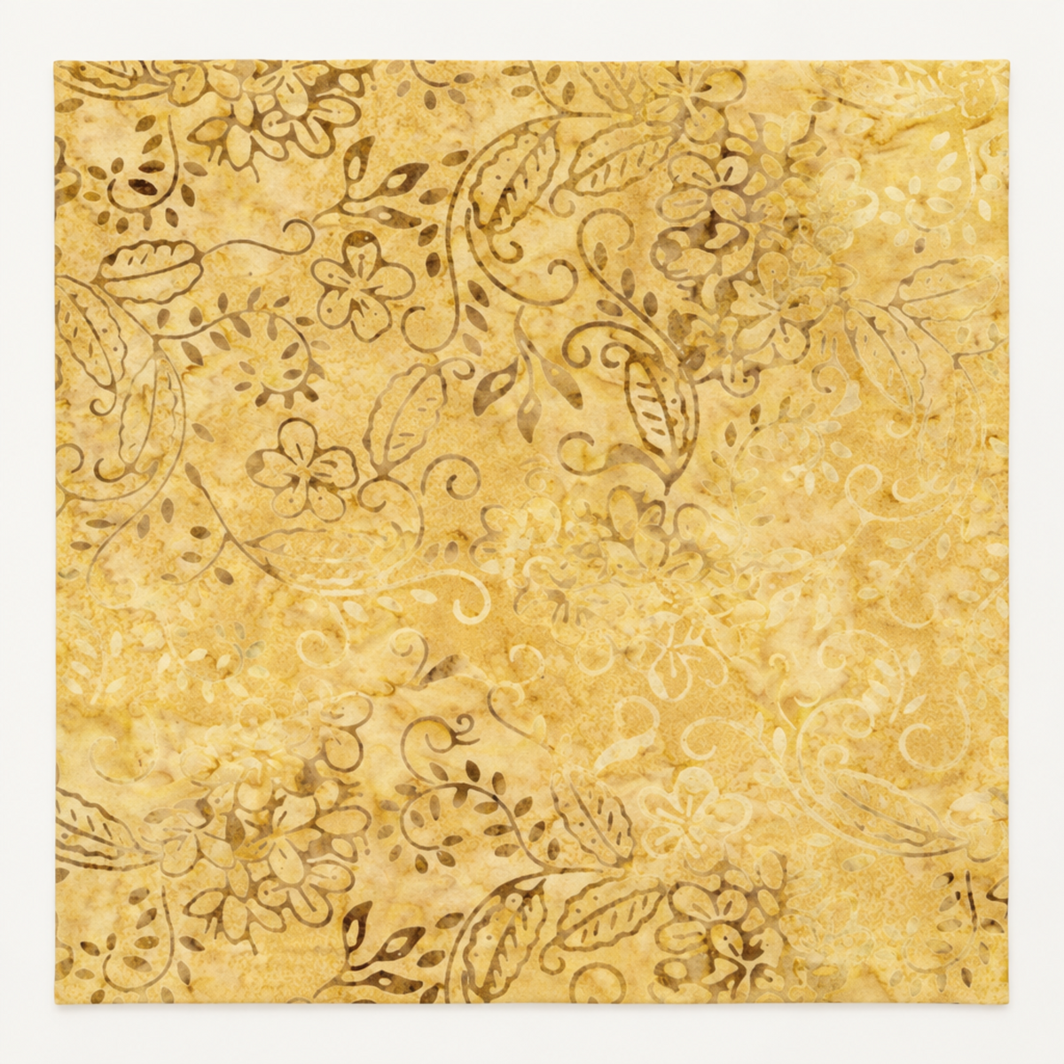 Flat swatch of Windsong Tonga Batiks Viney Floral Fawn fabric by Wing and a Prayer Design for Timeless Treasures, with delicate tonal flowers, curling vines, and leaves on fawn gold.