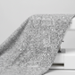 Writing on the Wall Well Worded White quilting cotton draped over sewing machine edge — grey typography fabric by FreeSpirit Fabrics