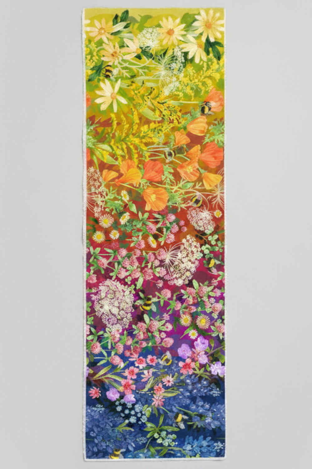 Wild Blossoms Rainbow quilting cotton by Robin Pickens for Moda Fabrics — vertical Pinterest pin showing full yard of fabric with complete rainbow ombré sweep from golden yellow daisies and bumblebees at top through orange California poppies, red, magenta clover and Queen Anne's lace, purple wildflowers, to cobalt blue bluebells at bottom — available at IraRobi Quilts